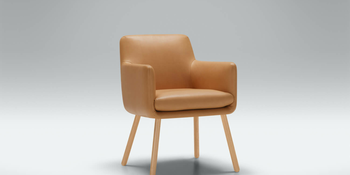 Fauteuil Moa Bistro en lin gris foncé avec une bibliothèque intégrée Le fauteuil en lin gris foncé est placé près d'une bibliothèque intégrée, offrant un coin lecture confortable et pratique.