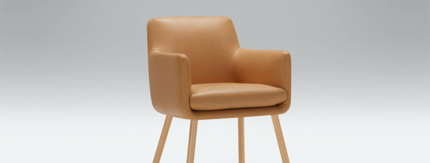 Fauteuil Moa Bistro en lin gris foncé avec une bibliothèque intégrée Le fauteuil en lin gris foncé est placé près d'une bibliothèque intégrée, offrant un coin lecture confortable et pratique.