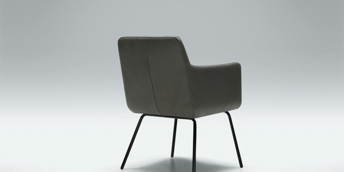 Fauteuil Moa Bistro en cuir noir avec une lampe sur pied moderne Le fauteuil en cuir noir est accompagné d'une lampe sur pied moderne, offrant un éclairage doux idéal pour les soirées de lecture.