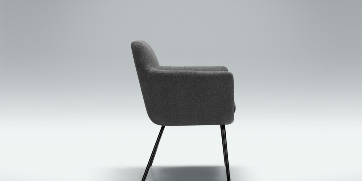 Fauteuil Moa Bistro en velours vert émeraude avec des coussins décoratifs dorés Le fauteuil en velours vert émeraude est rehaussé de coussins dorés, créant un coin lecture chic et sophistiqué.