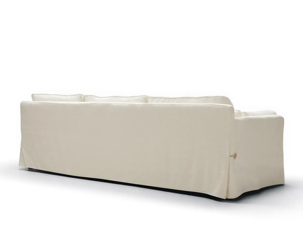 Canapé beige avec housse, vu de dos sur fond blanc. Canape Paris by Atelier Bis
