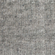 Gros plan d'un tissu gris texturé avec un motif de tissage visible et de petites mouchetures de fils plus foncés. Canape Paris by Atelier Bis