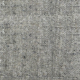 Gros plan d'un tissu gris texturé avec de petites fibres visibles et une surface légèrement rugueuse. Canape Paris by Atelier Bis