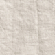 Gros plan sur un tissu de lin beige montrant sa texture, son motif de tissage et ses plis subtils. Canape Paris by Atelier Bis