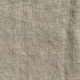 Gros plan sur un tissu de lin beige dont la texture tissée est visible et les plis subtils. Canape Paris by Atelier Bis